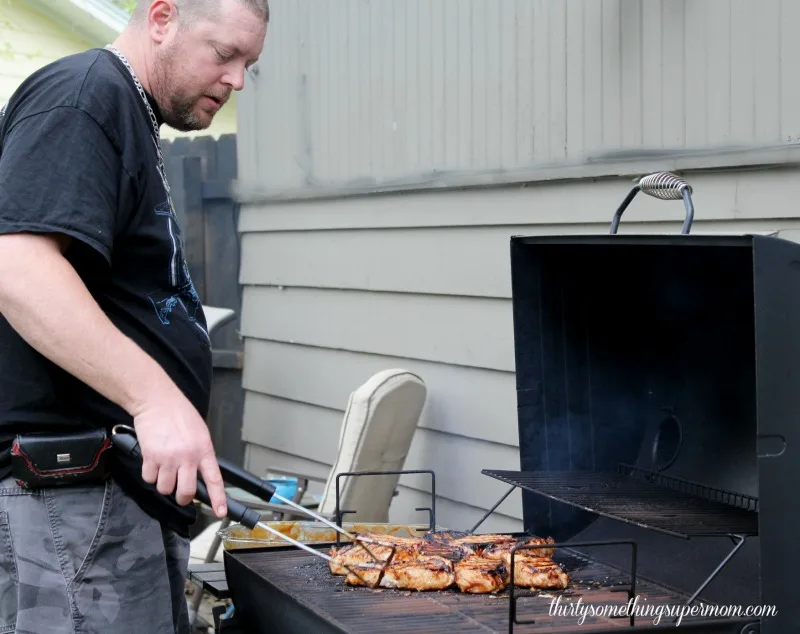 BBQ Pork Chops Marinated Recipe cooking on grill 