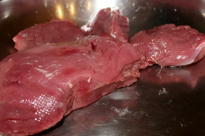 Venison in pan searing for slow cooker stew. 