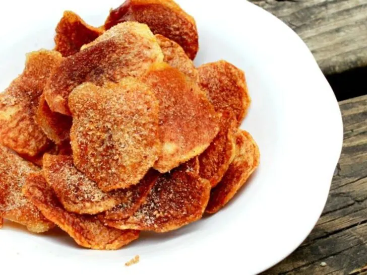 homemade barbecue potato chips on white plate