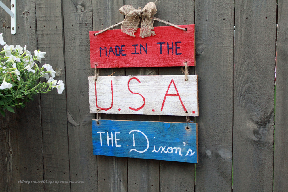 Hanging a DIY Patriotic Hanging Sign made from fence picket