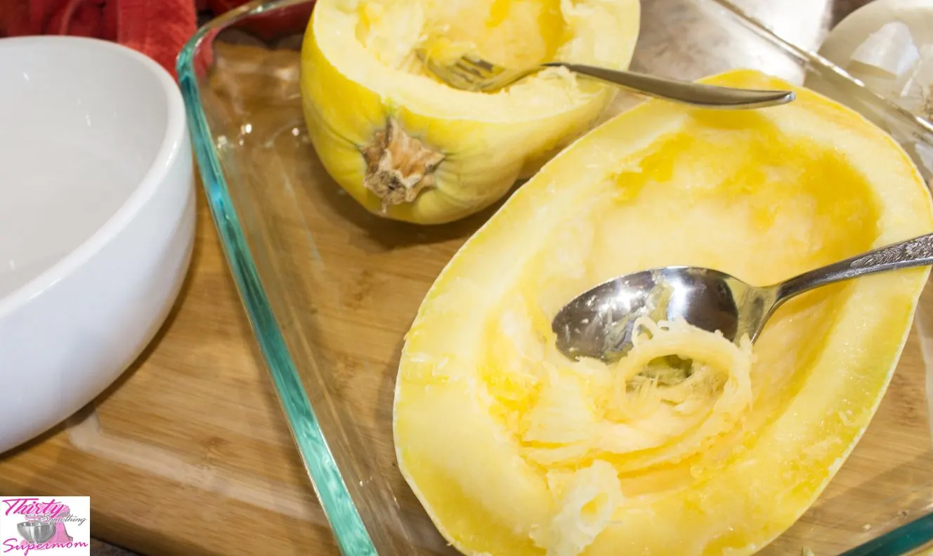 Spooning Spaghetti squash out of yellow squash 