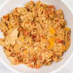 Slow Cooker Chicken Cacciatore in bowl with bay leaf