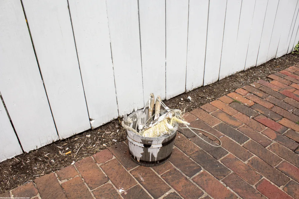 bucket of paint by Tom Sawyer fence