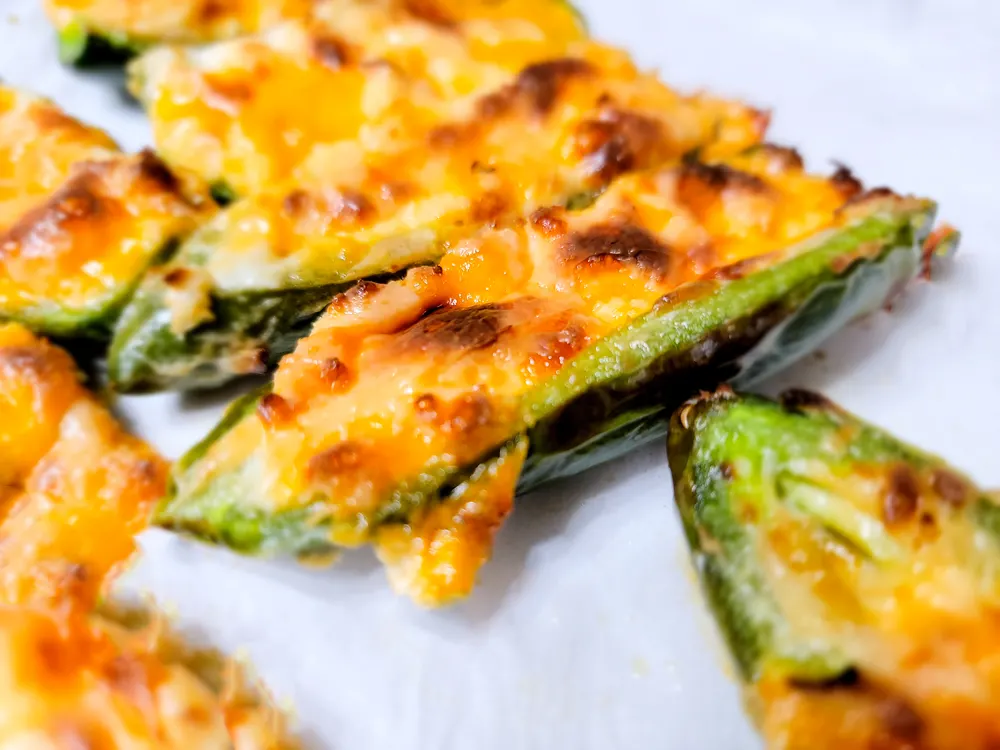 low carb baked jalapeno poppers on white plate. 