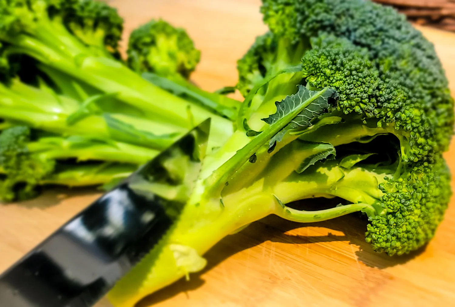 Broccoli on cutting board with other keto vegetables