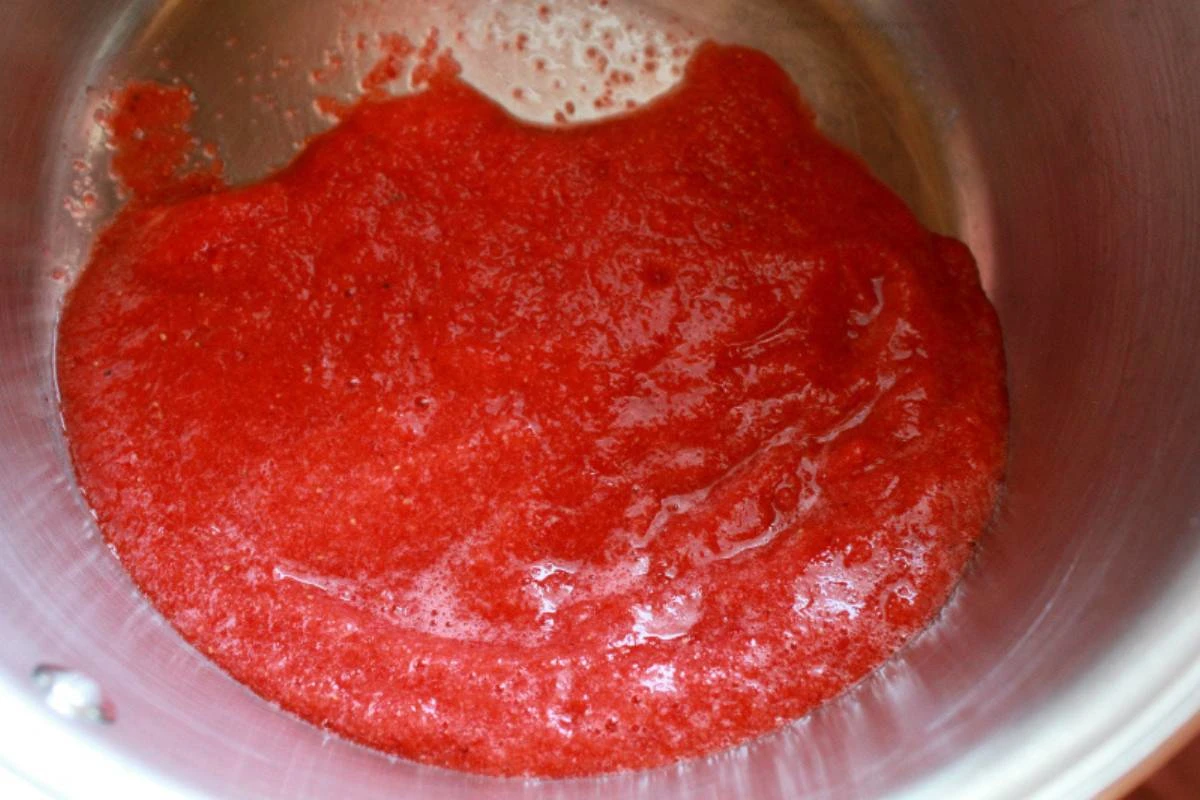 making strawberry jam in pot