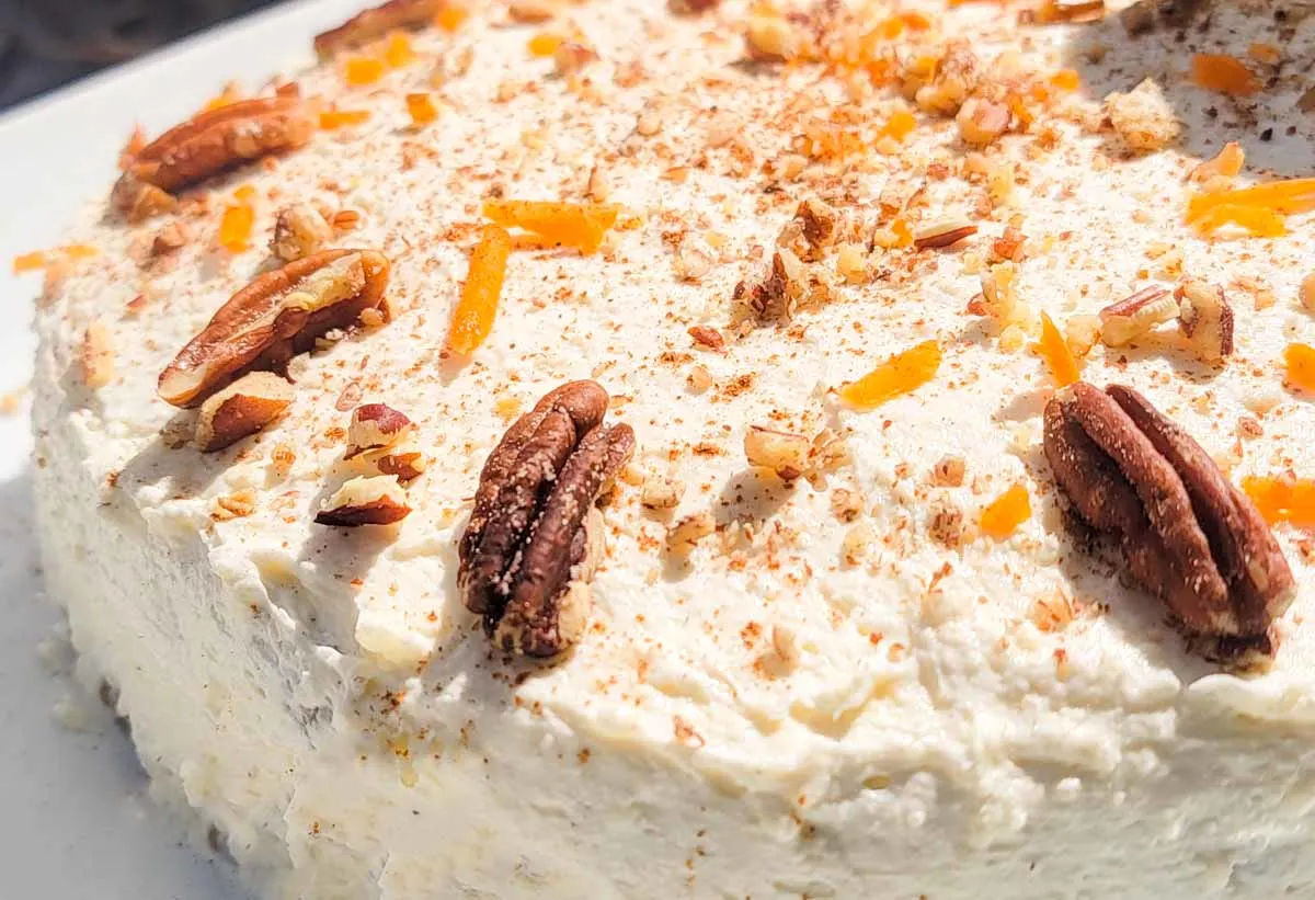 keto carrot cake frosted with low-carb cream cheese frosting.