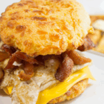 Keto Air Fryer Biscuits used as breakfast sandwich with eggs.