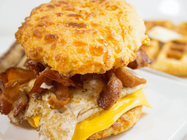 Keto Air Fryer Biscuits used as breakfast sandwich with eggs.