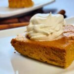 Crustless keto pumpkin cheesecake cut into individual squares